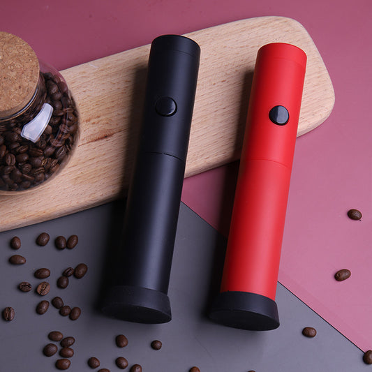 Red handheld electric milk frother with storage cap
